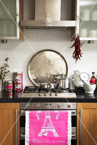 Cooker with tea towel and pans
