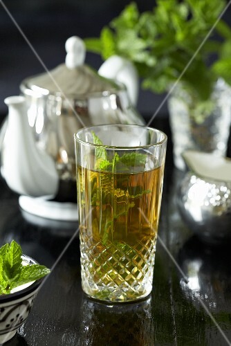 Mint tea in a glass, teapot