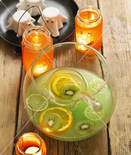 Punch with kiwi fruit and citrus fruit for Halloween