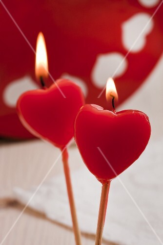 Two red heart-shaped candles
