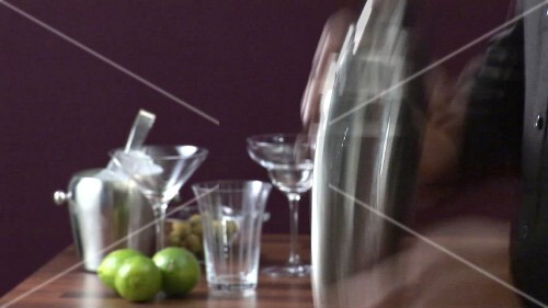 Shaking a cocktail vigorously in a shaker