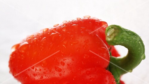 Spraying a red pepper with water