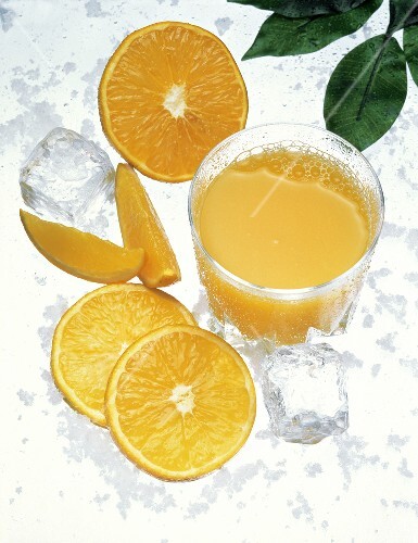 Orange Juice in a Glass with Orange Slices and Ice