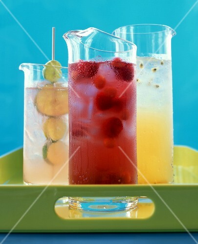 Passion fruit-, raspberry- and lime juice on tray