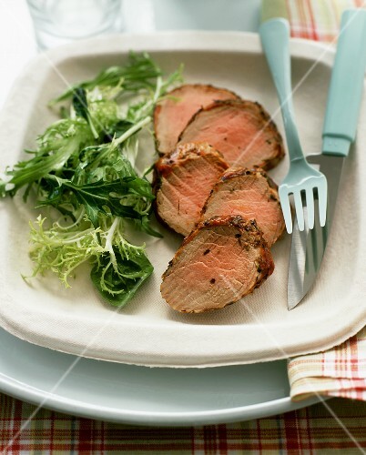 Cold pork fillet, sliced, with salad garnish