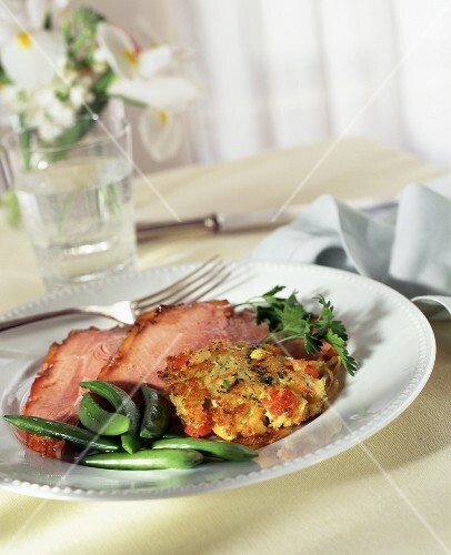 Sliced Baked Ham with Snap Peas and Vegetable Cake