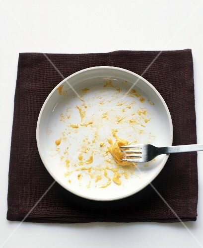 A White Bowl with Remnants of Macaroni and Cheese