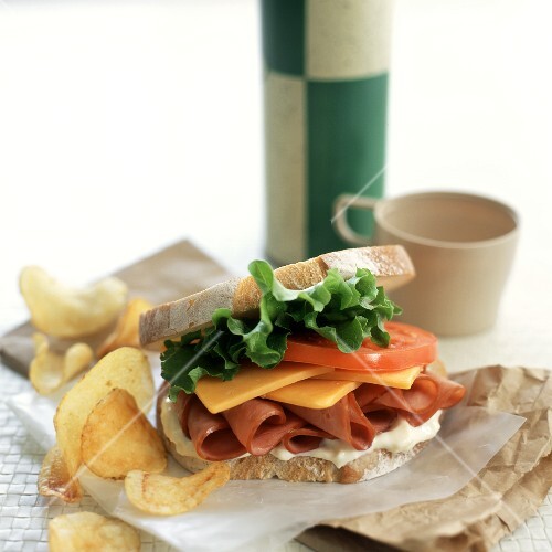 Ham, cheese and tomato sandwich; crisps