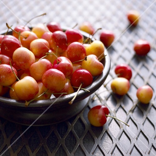 Yellow Cherries in and Beside a Bowl