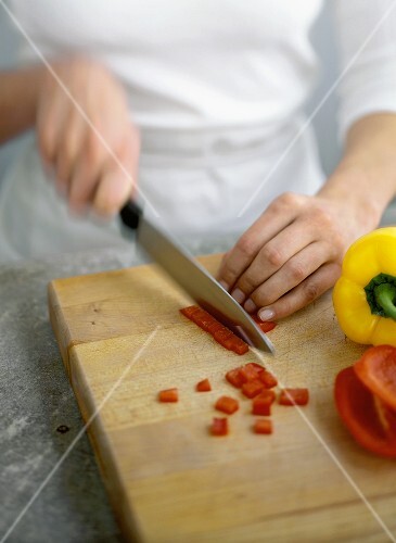 Slicing Red Peppers on a Cutting Board