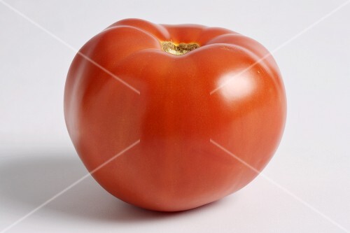Whole Red Tomato on a White Background