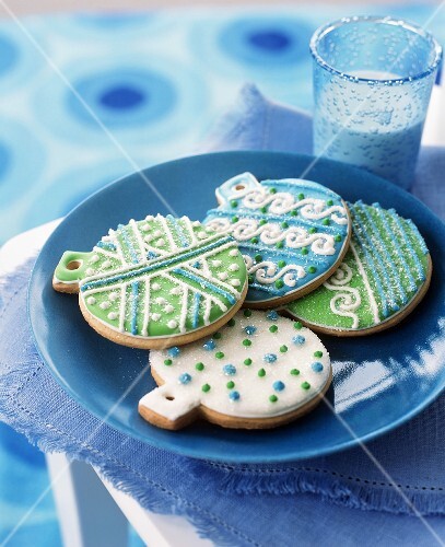 Festive Blue, Green and White Decorated Christmas Bulb Cookies; Glass of Milk