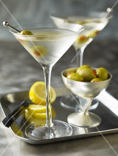 Two Martinis with olives on a tray