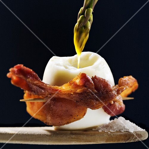 Boiled Egg Wrapped in Bacon with Asparagus Dipping in Yolk, Sea Salt