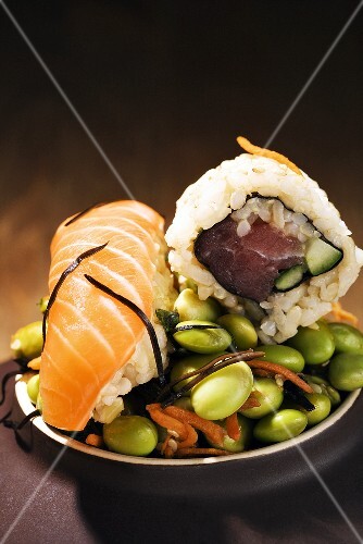 Tuna Roll and Salmon Sushi on a Bed of Edamame