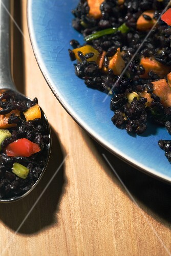 Forbidden Black Rice Salad on a Blue Plate and Spoon