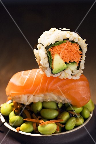 Two Pieces of Sushi on a Bed of Edamame