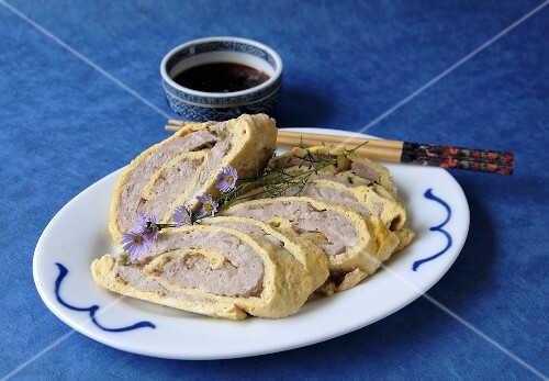 Steamed Pork Filled Egg Wrappers on a Plate