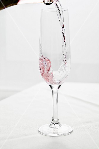 Pourig Champagne From Bottle into Flute