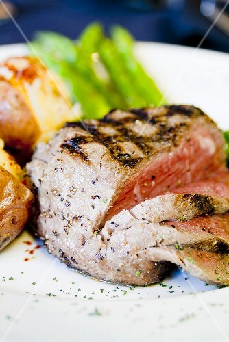 Partially Sliced Grilled Rib Eye; Potatoes and Asparagus