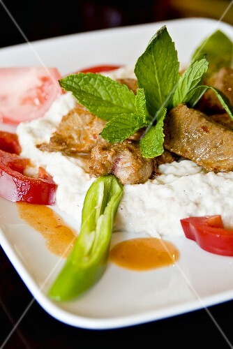 Lamb Kebab Served with Yogurt and Warm Tomato-Butter Sauce
