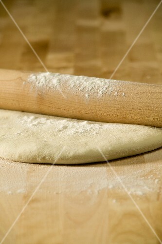Floured Rolling Pin on Pizza Dough