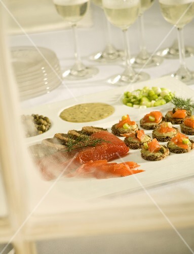 Appetizer Tray on a Table with Serving Plates and Glasses ofWine