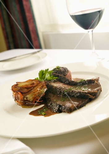 Sliced Roast Beef Tenderloin with Gravy and Vegetable Timbale