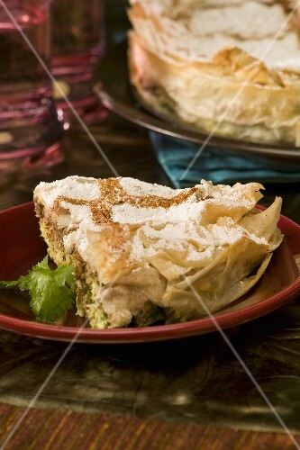 A Bastilla Wedge with Powdered Sugar