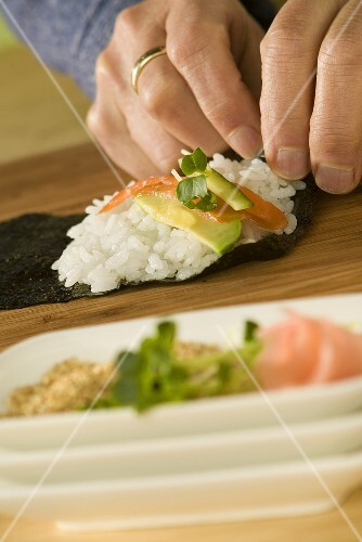 Hands Rolling Sushi