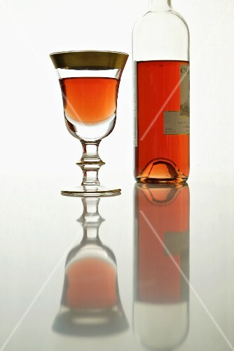 Glass and Bottle of Light Organic Rose Wine