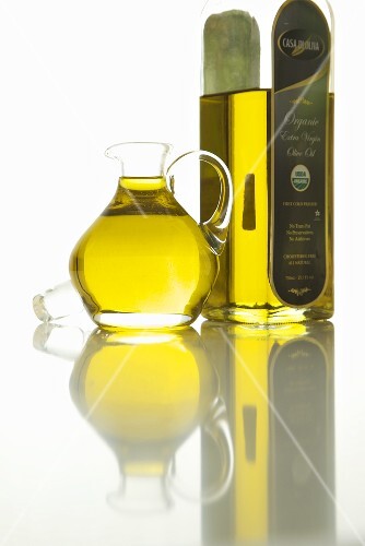 Bottle and Pitcher of Organic Cold Press Olive Oil