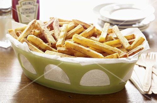 Basket of French Fries on Table