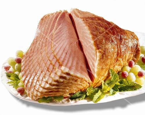 Partially Sliced Spiral Ham on Platter; White Background