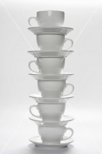 White Coffee Cups and Saucers Stacked
