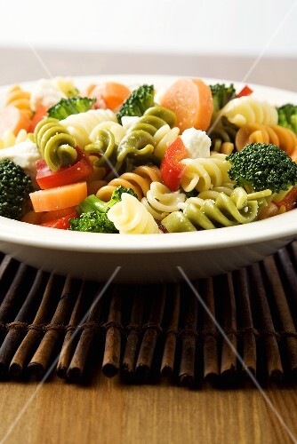 Bowl of Tri-Colored Pasta with Vegetables and Cheese