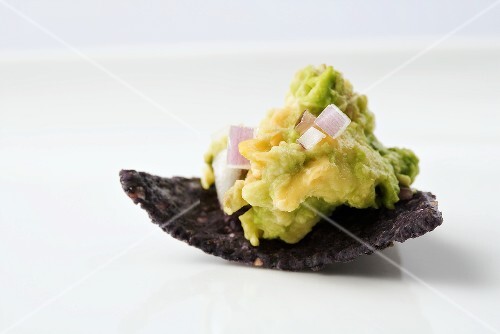 Organic Guacamole on a Blue Corn Chip