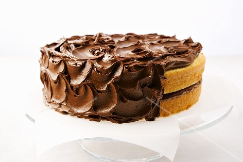 Partially Frosted Double Layered Yellow Cake; Chocolate Frosting