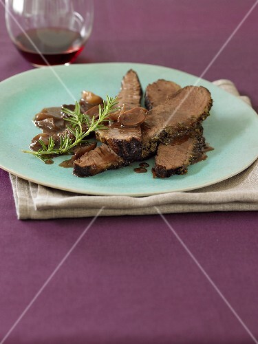 Sliced Beef Brisket with Mushroom Gravy; Rosemary Sprig