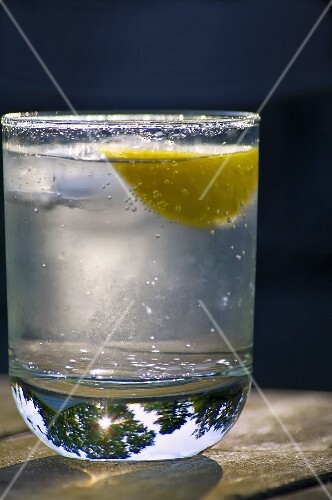 Glass of Seltzer with Lemon on a Table